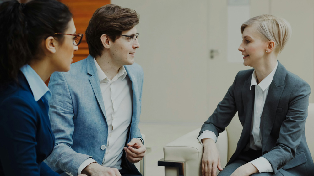 Leaders in a coaching discussion